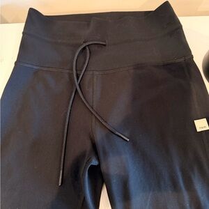 Black Vuori with draw string. Long. Size small